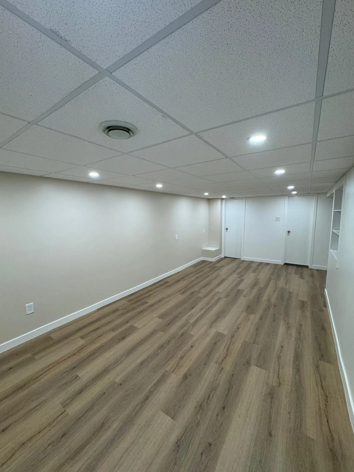 Far end of the basement, doors through to the utility side