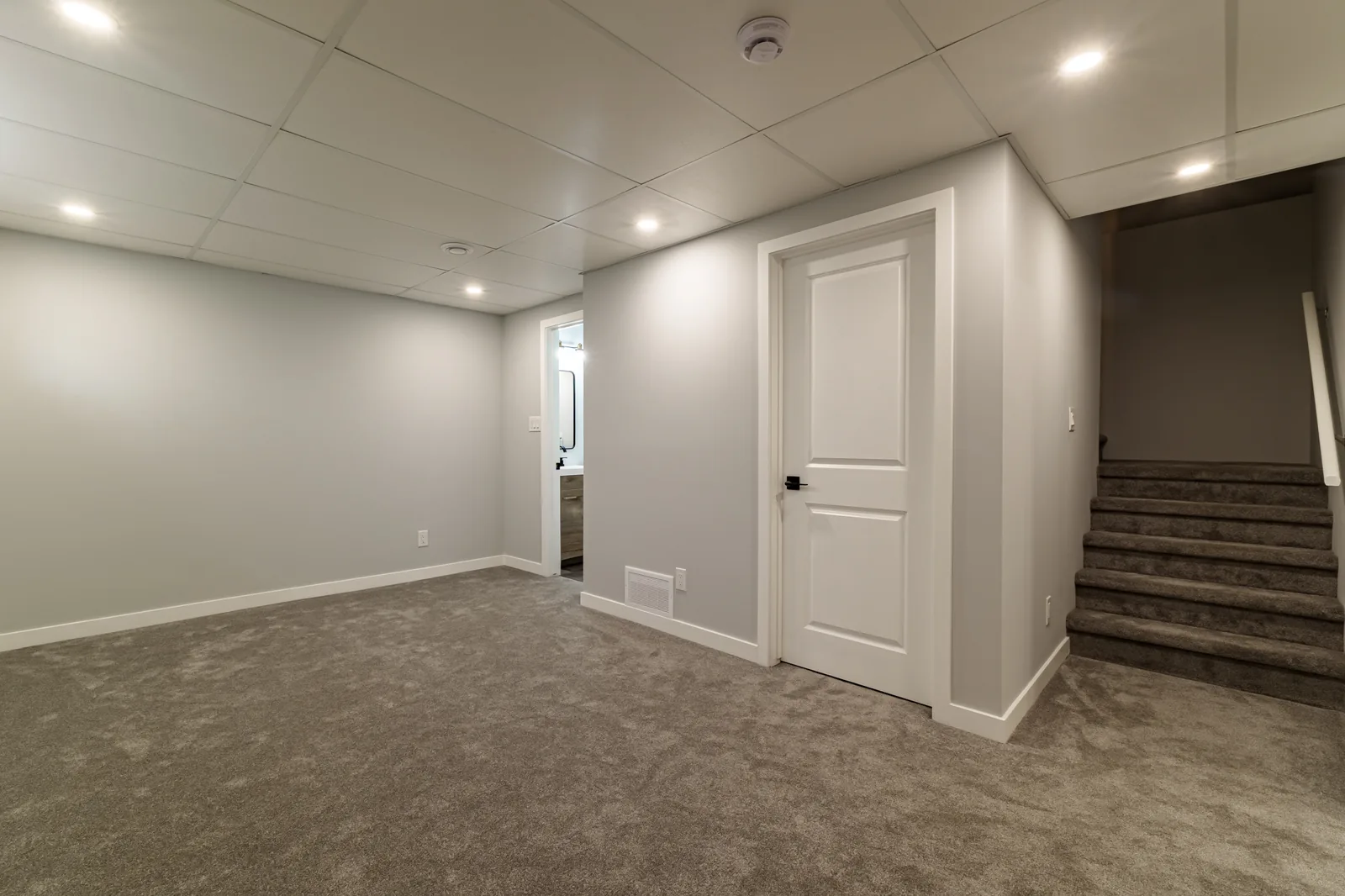 Rec room looking back to the stair and the doors off it
