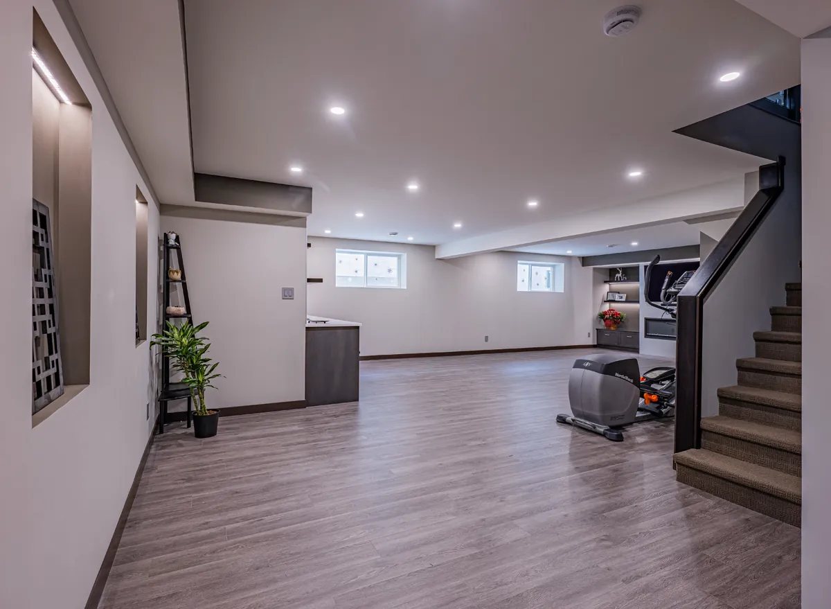 The lower level from the hall, stairs and open floor beyond