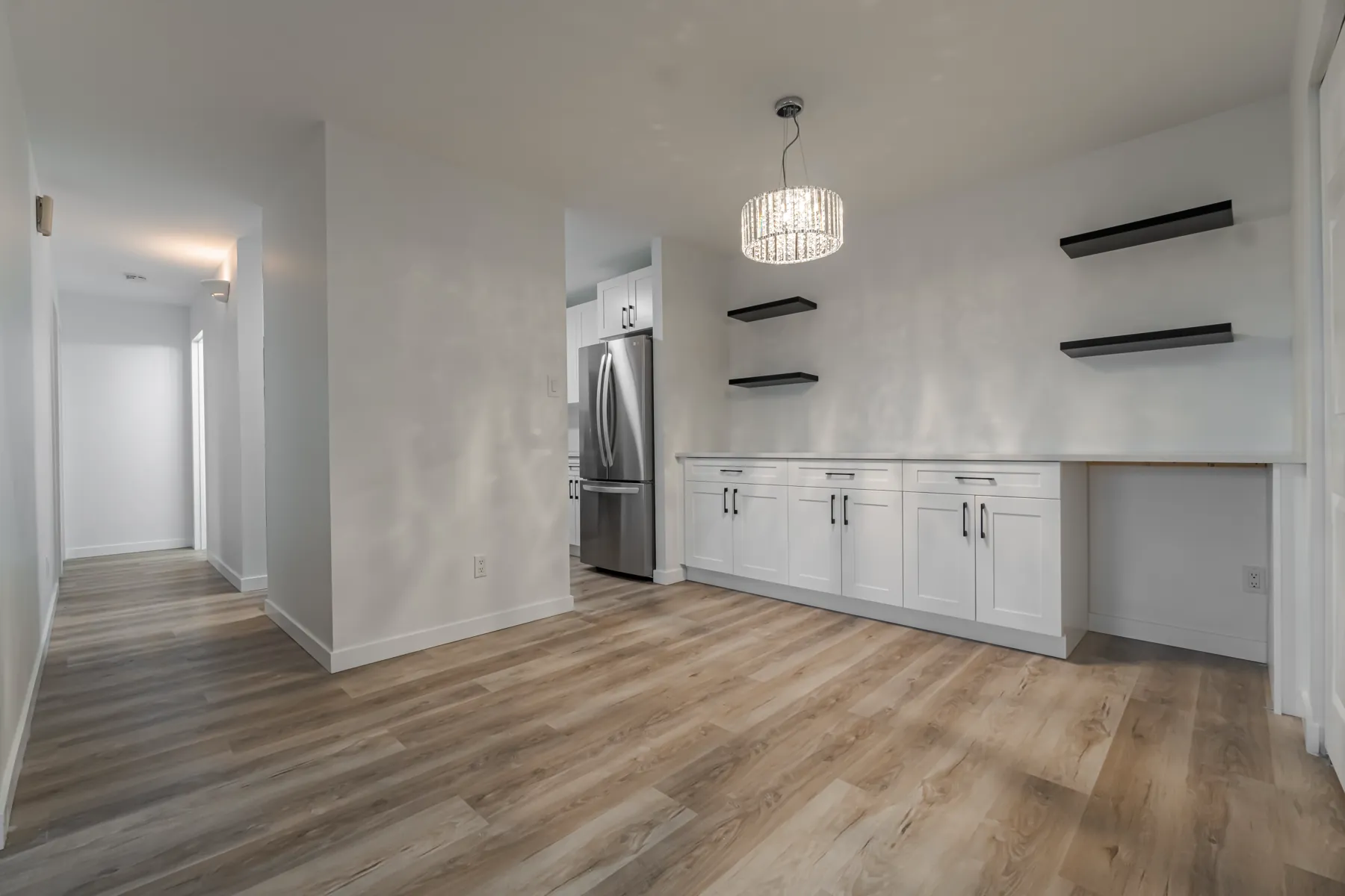 Down the hall to the kitchen, vinyl plank throughout