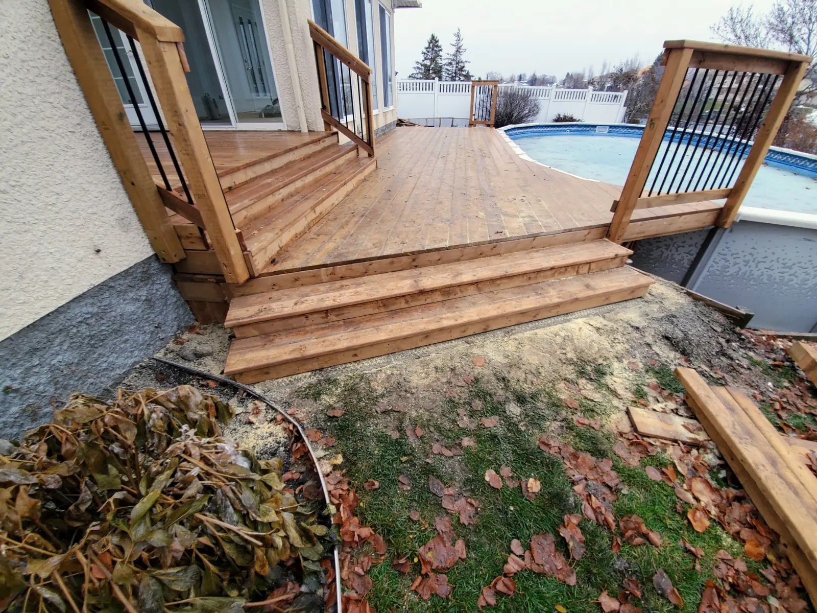 The stair and its railing from the pool side, water beyond