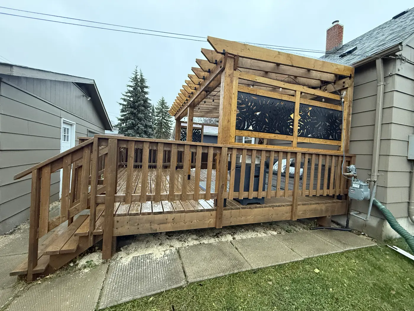 The railing run and screens along the side of the deck