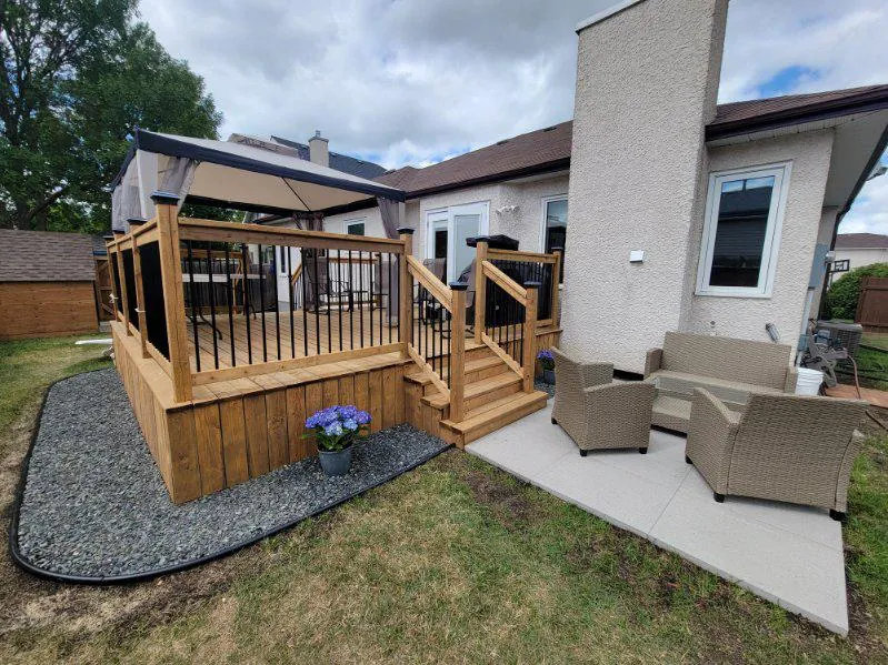 The deck and the patio beside it, seating set out on both