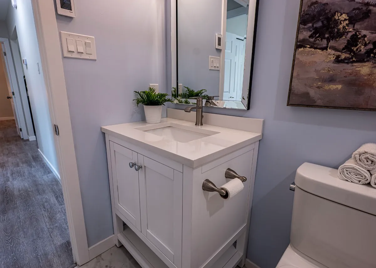 Vanity and framed mirror in the main bathroom