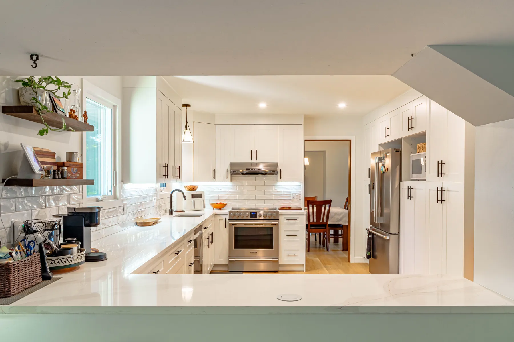 A PHS kitchen renovation in Winnipeg — semi-custom shaker cabinetry, quartz counters and luxury vinyl plank floors