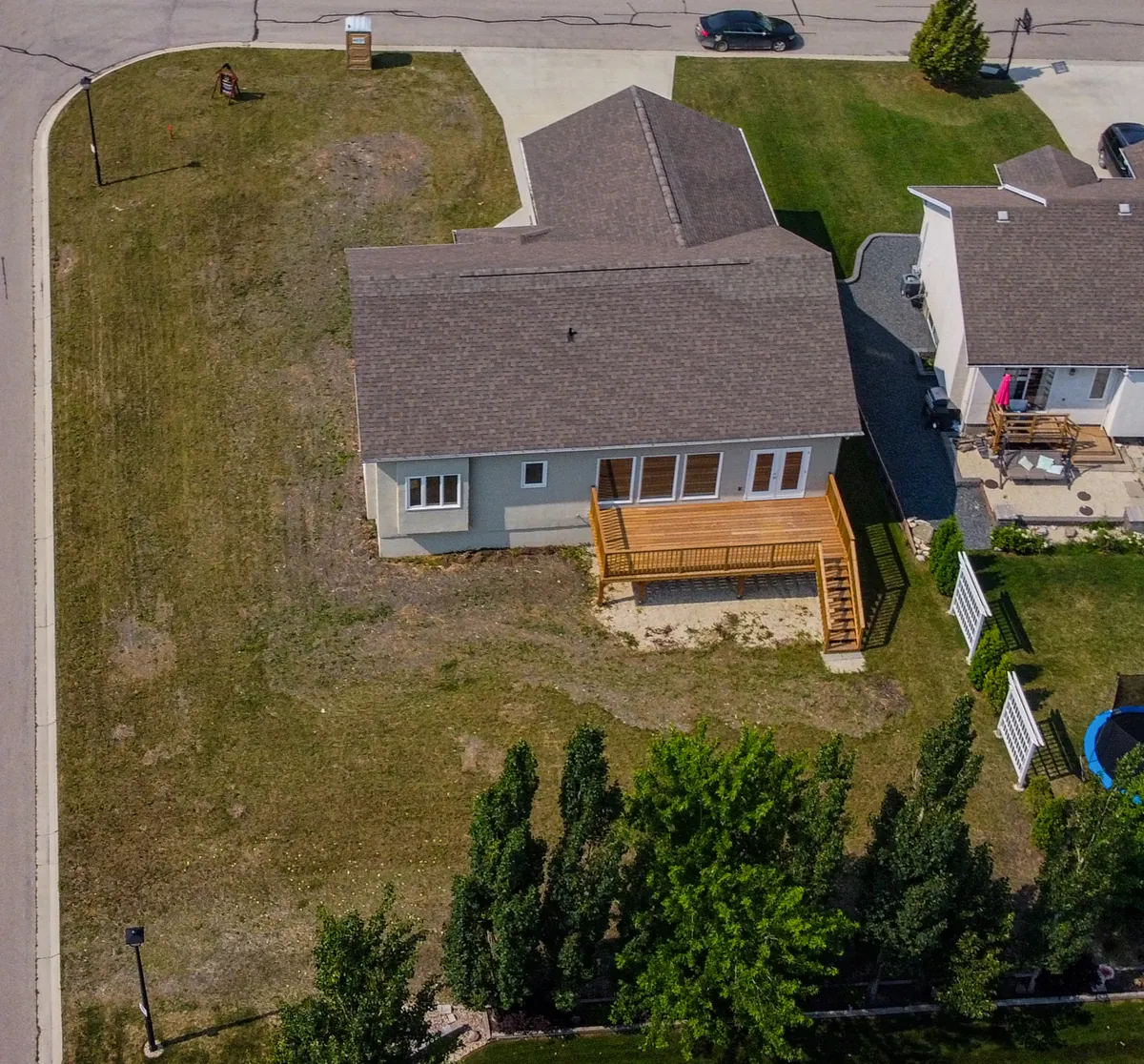 The finished house and its lot from the air