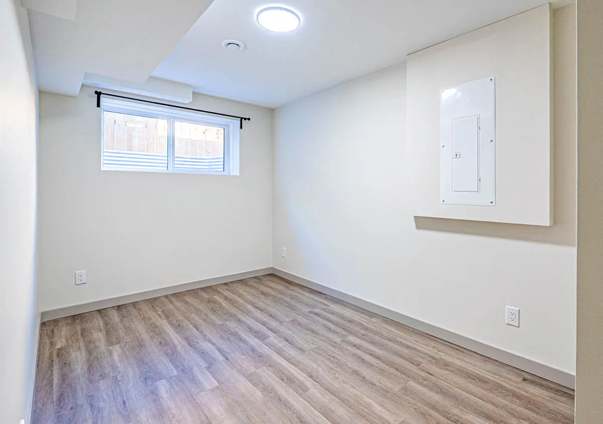 A basement bedroom with a window