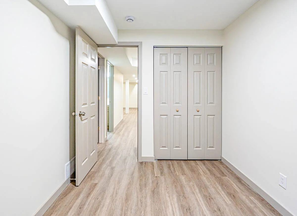 Basement hallway with closets