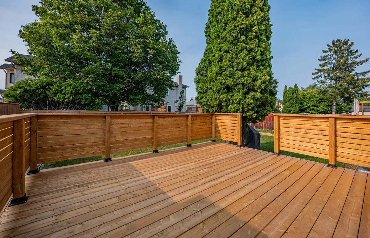 New cedar deck and privacy fence across the back of the house