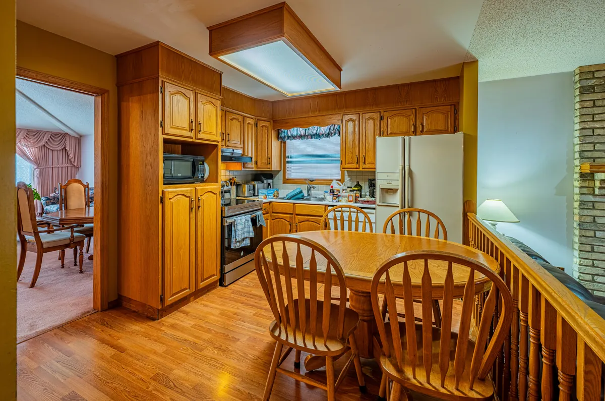Before: the oak kitchen with a table in the middle of the room