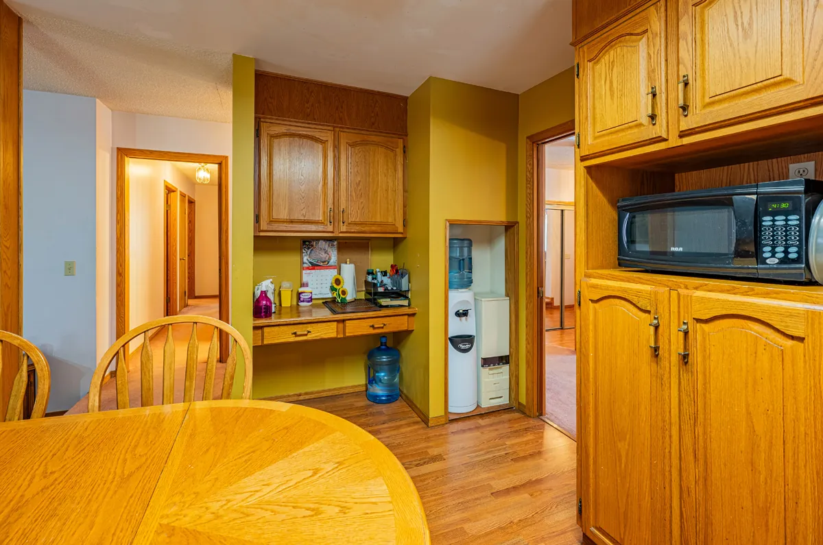 Before: the oak kitchen's desk nook and appliance wall