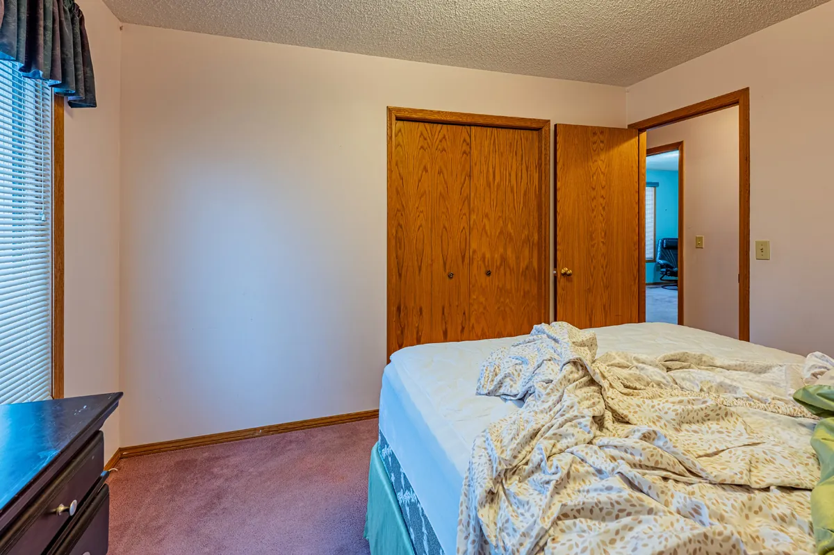 Before: the primary bedroom toward the door