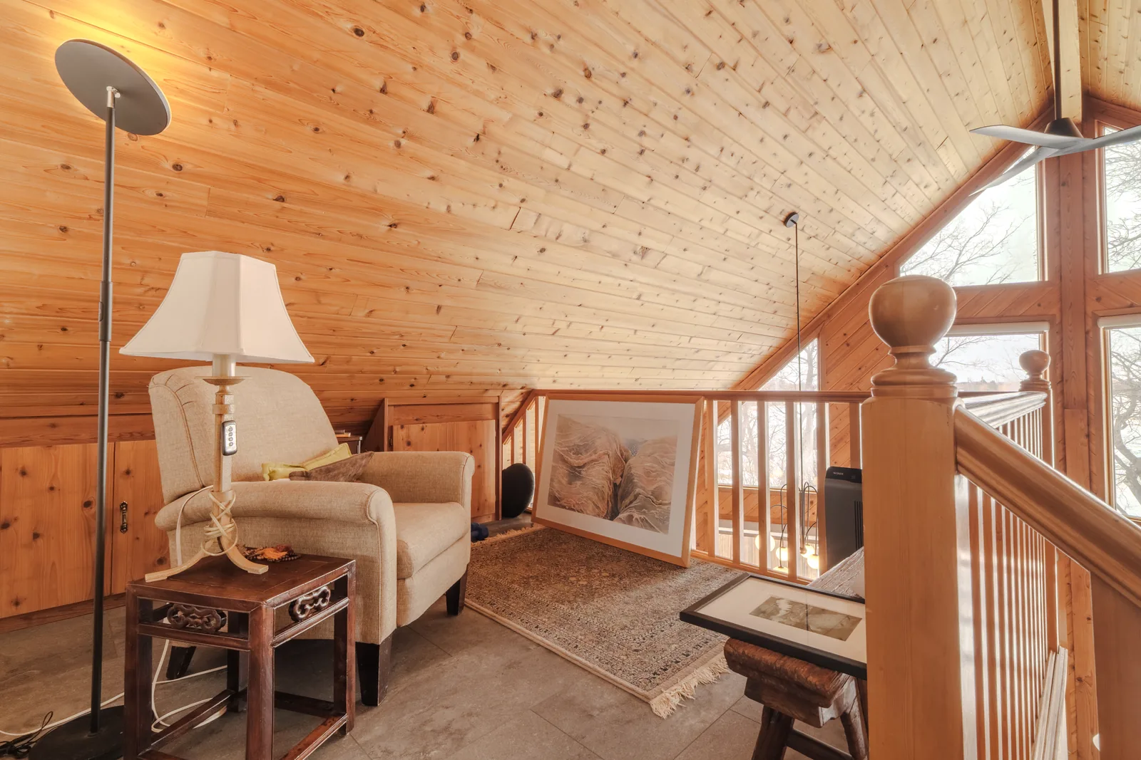 Loft sitting area above the main floor, timber ceiling overhead