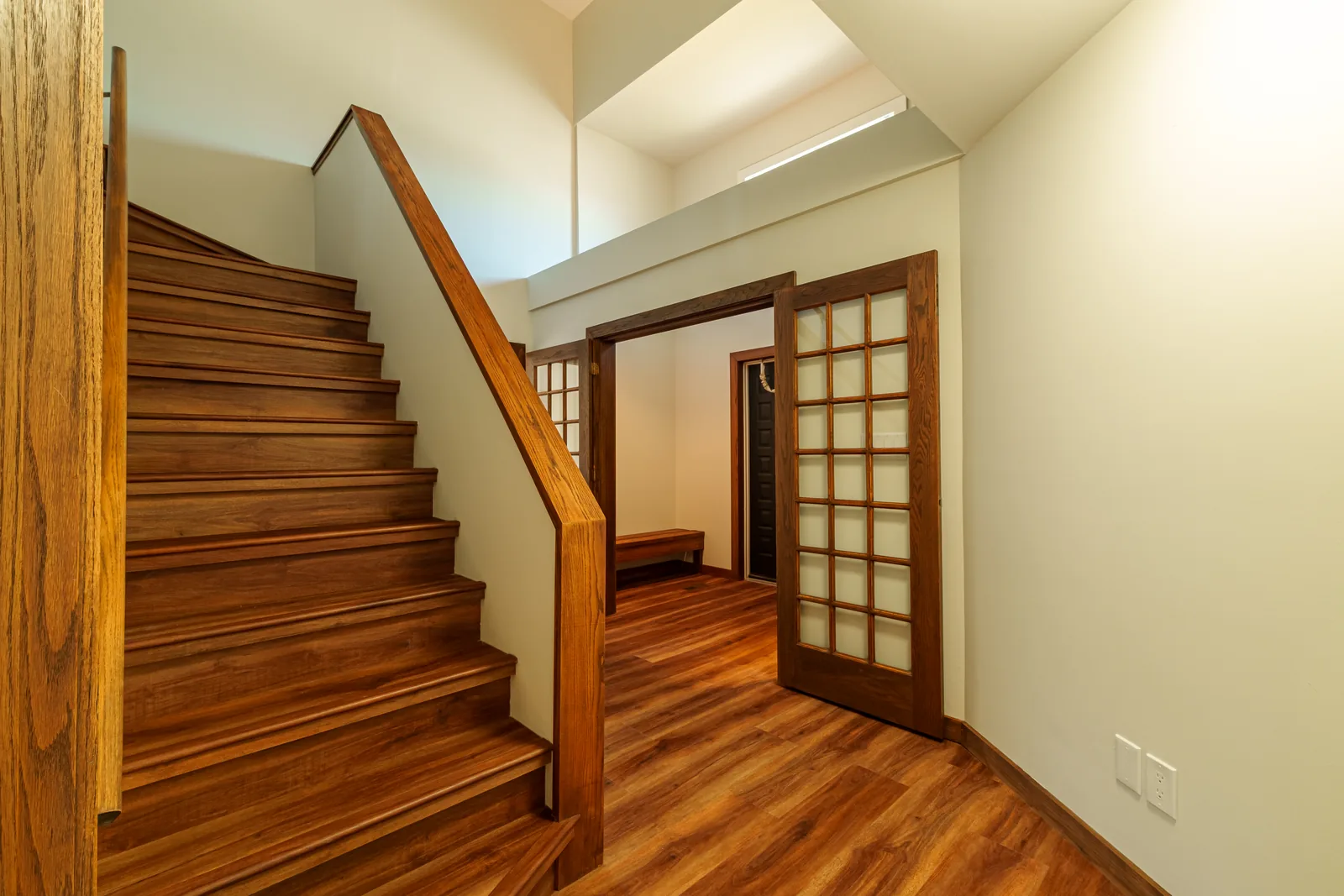Entry hall and stair, oak trim and doors kept against the new floor